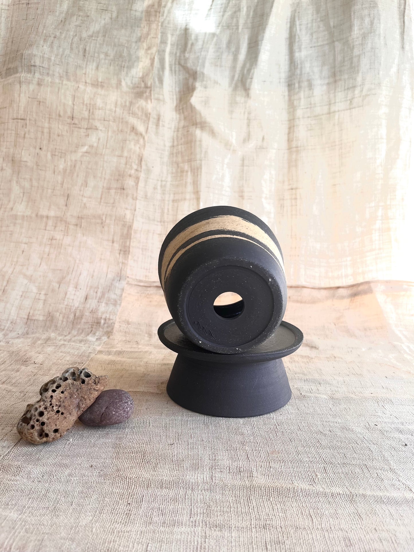 7 sand/black pedestal saucer set