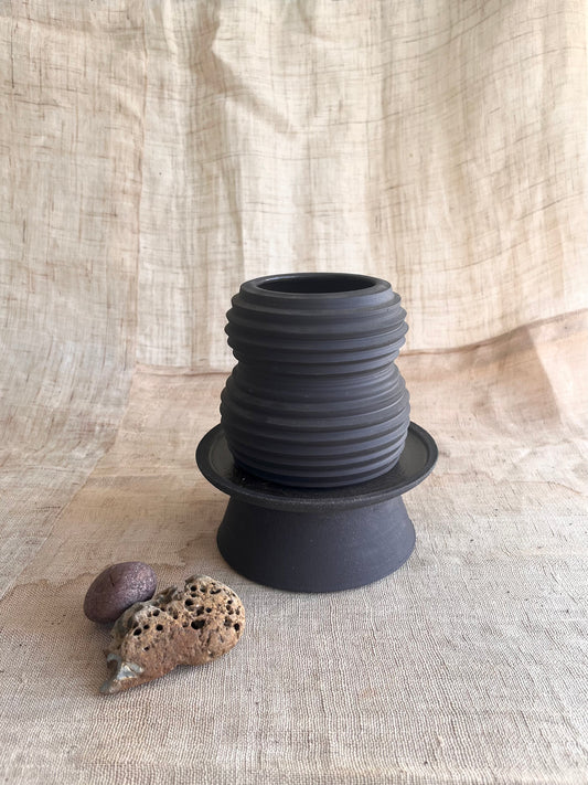 11 black pedestal saucer set